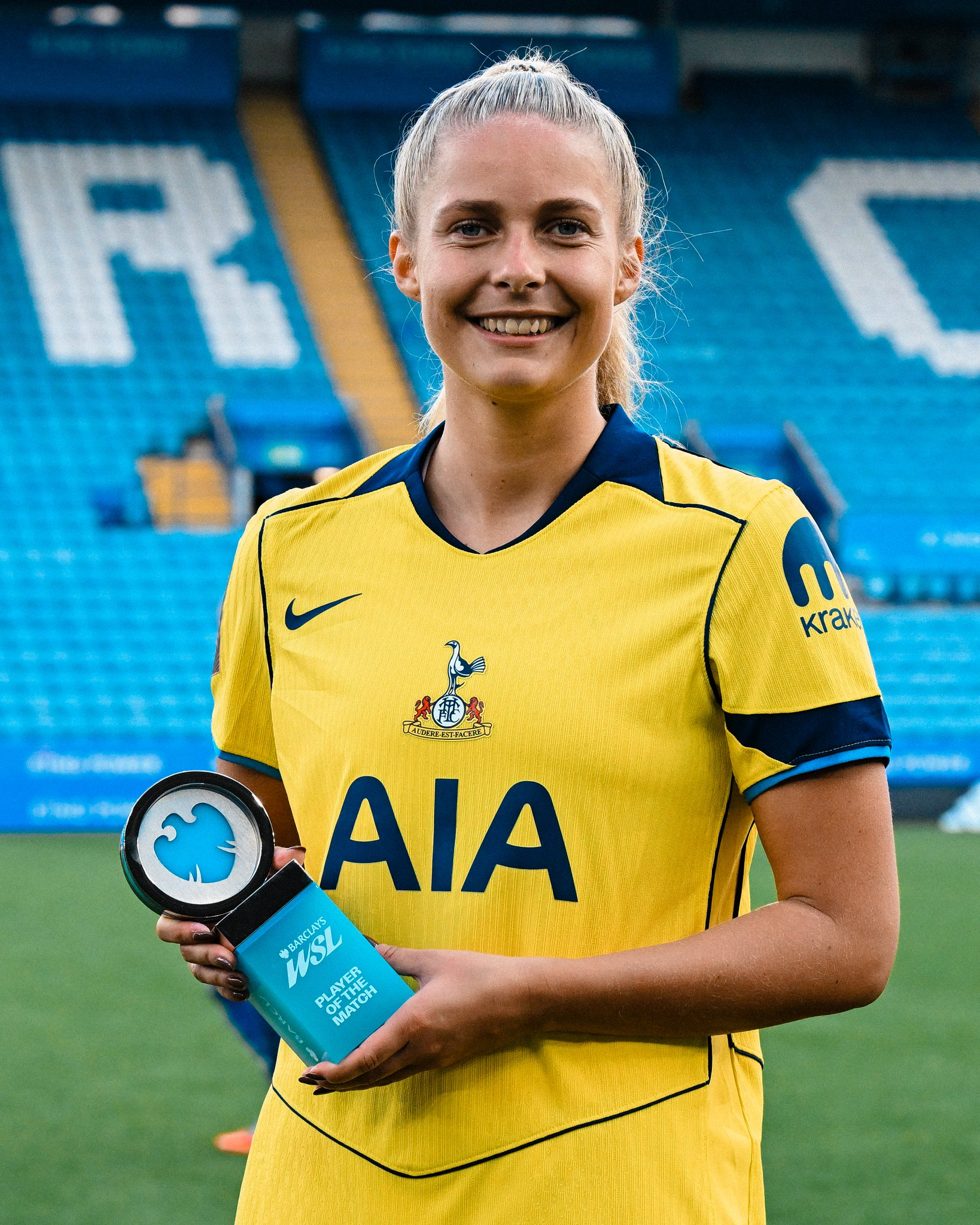 Olivia Holdt holds up her Player of the Match award.