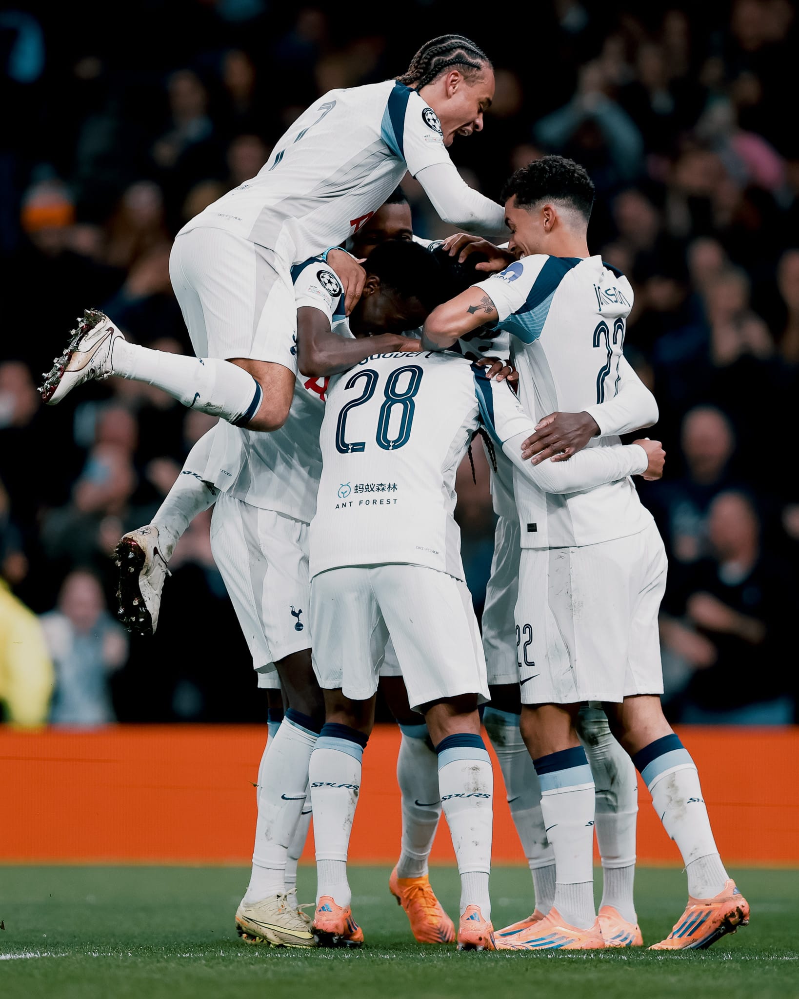 Wilson Odobert is jumped on by his teammates after scoring.