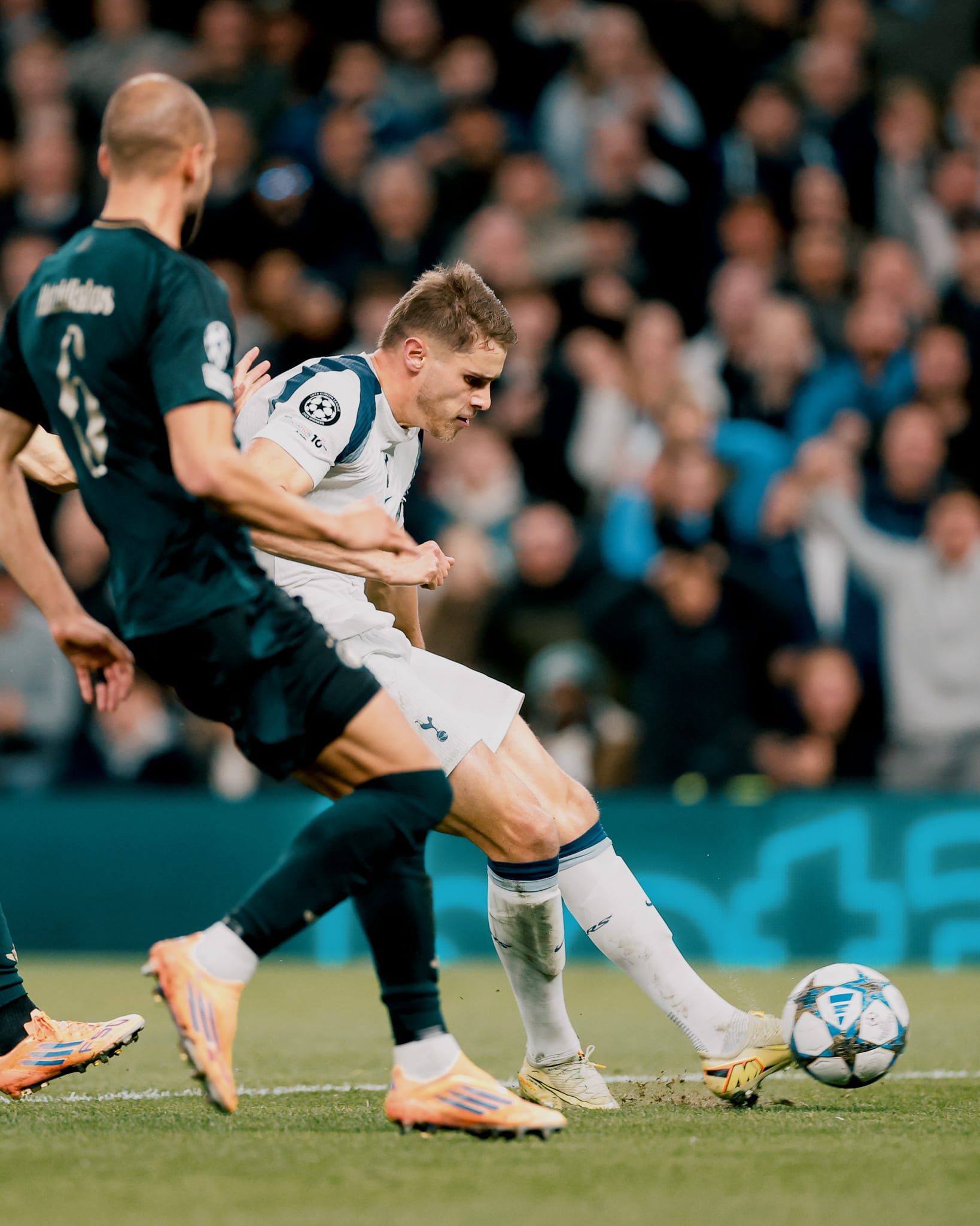 Micky van de Ven strikes the ball.