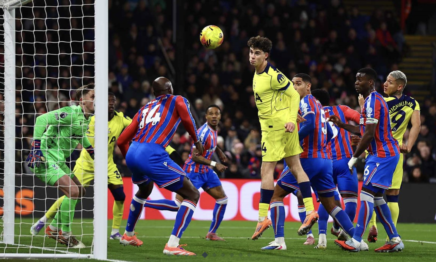 Archie Gray heads the ball into the net.