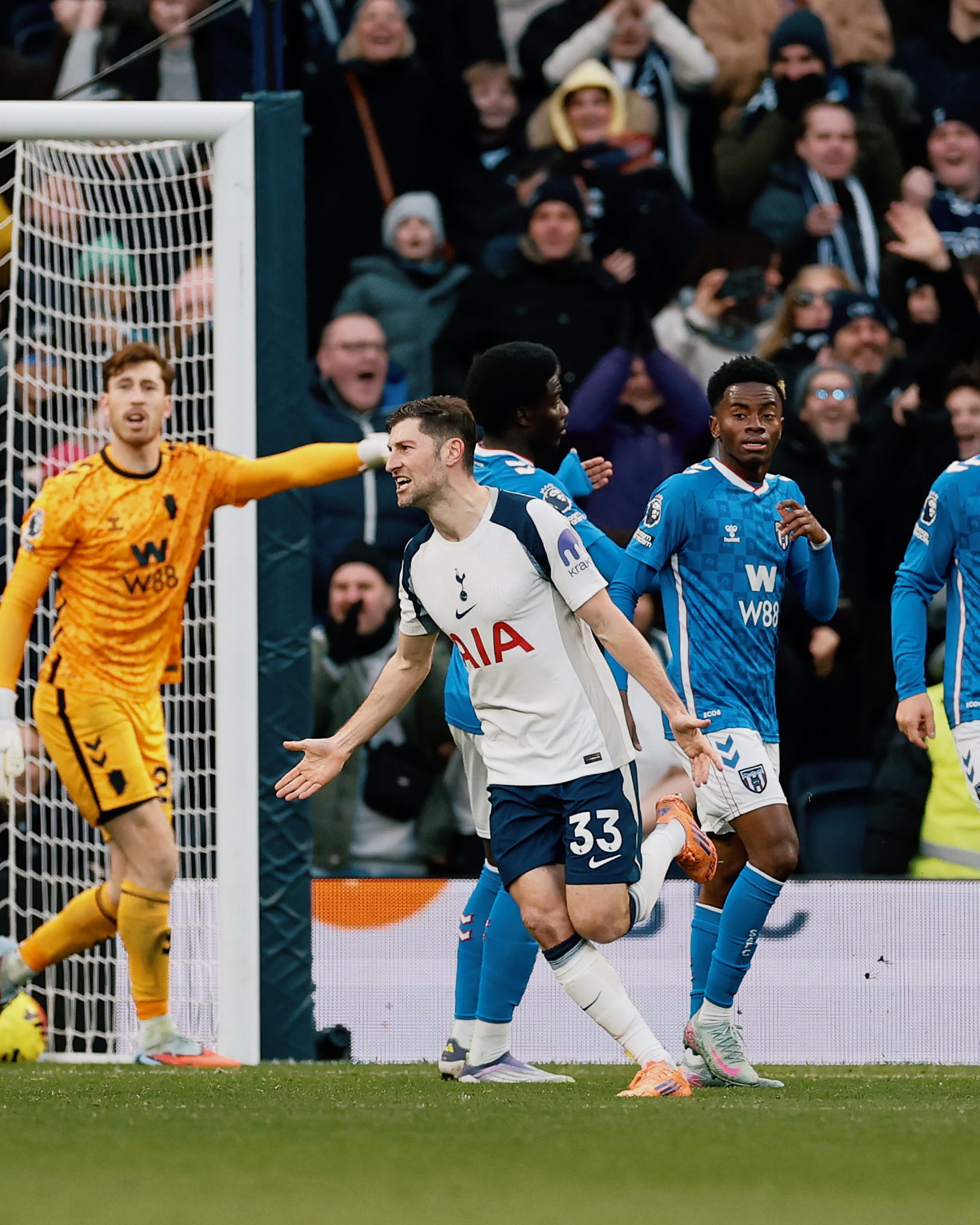 Ben Davies wheels away to celebrate scoring a goal.
