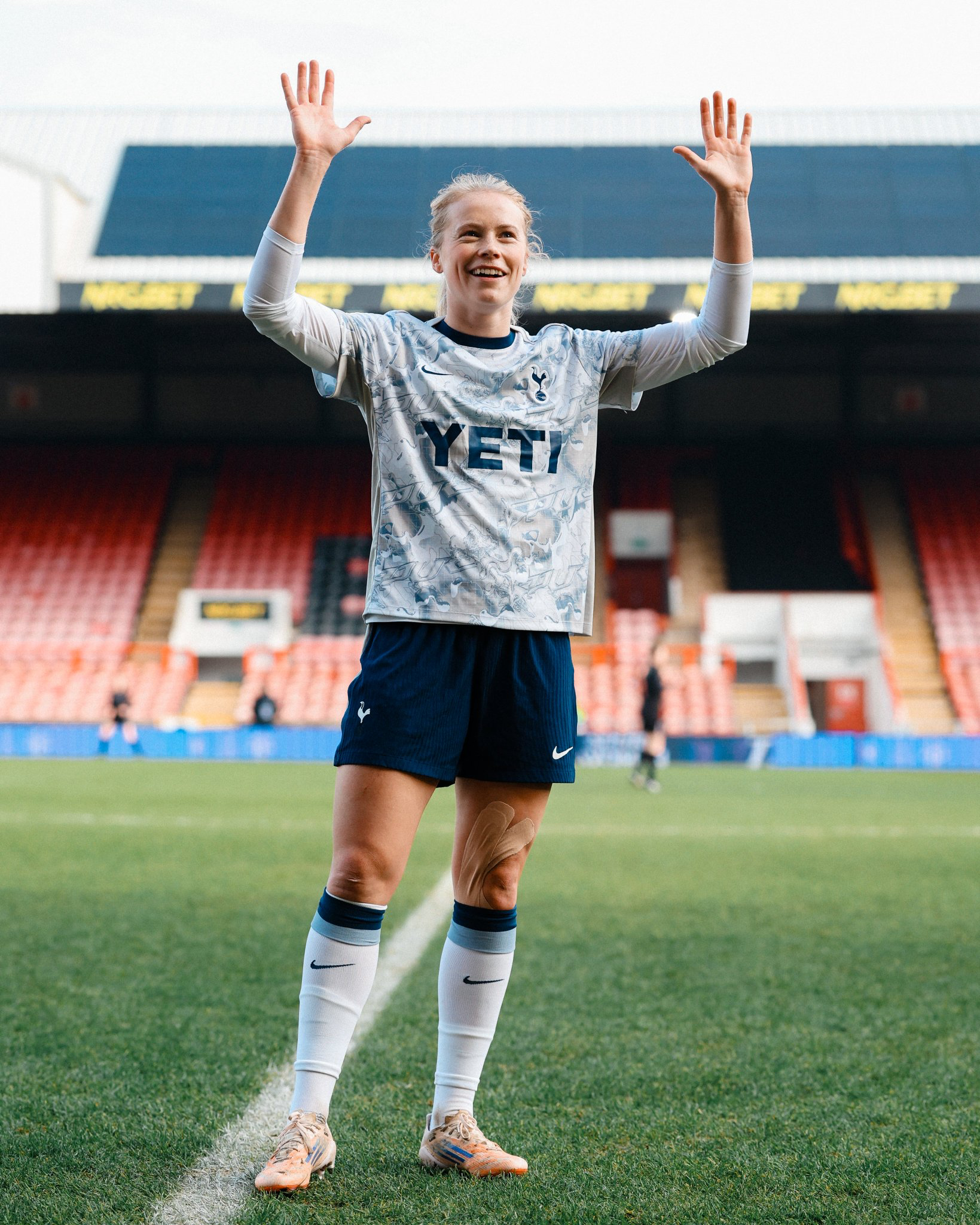 Julie Blakstad waves to her new fans at Brisbane Road before the game.