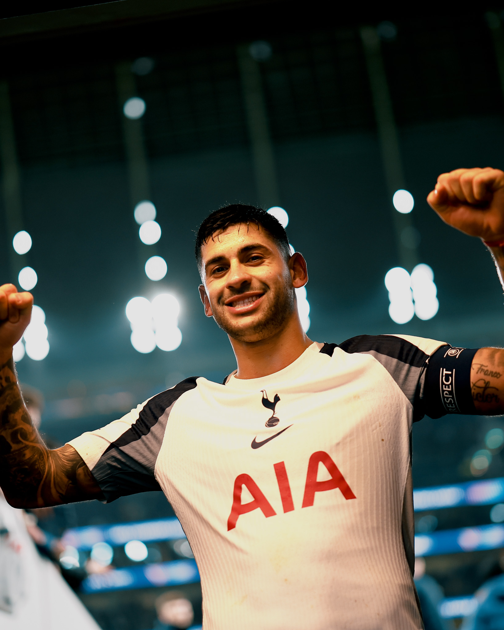 Cristian Romero celebrates as he enters the tunnel after the game.