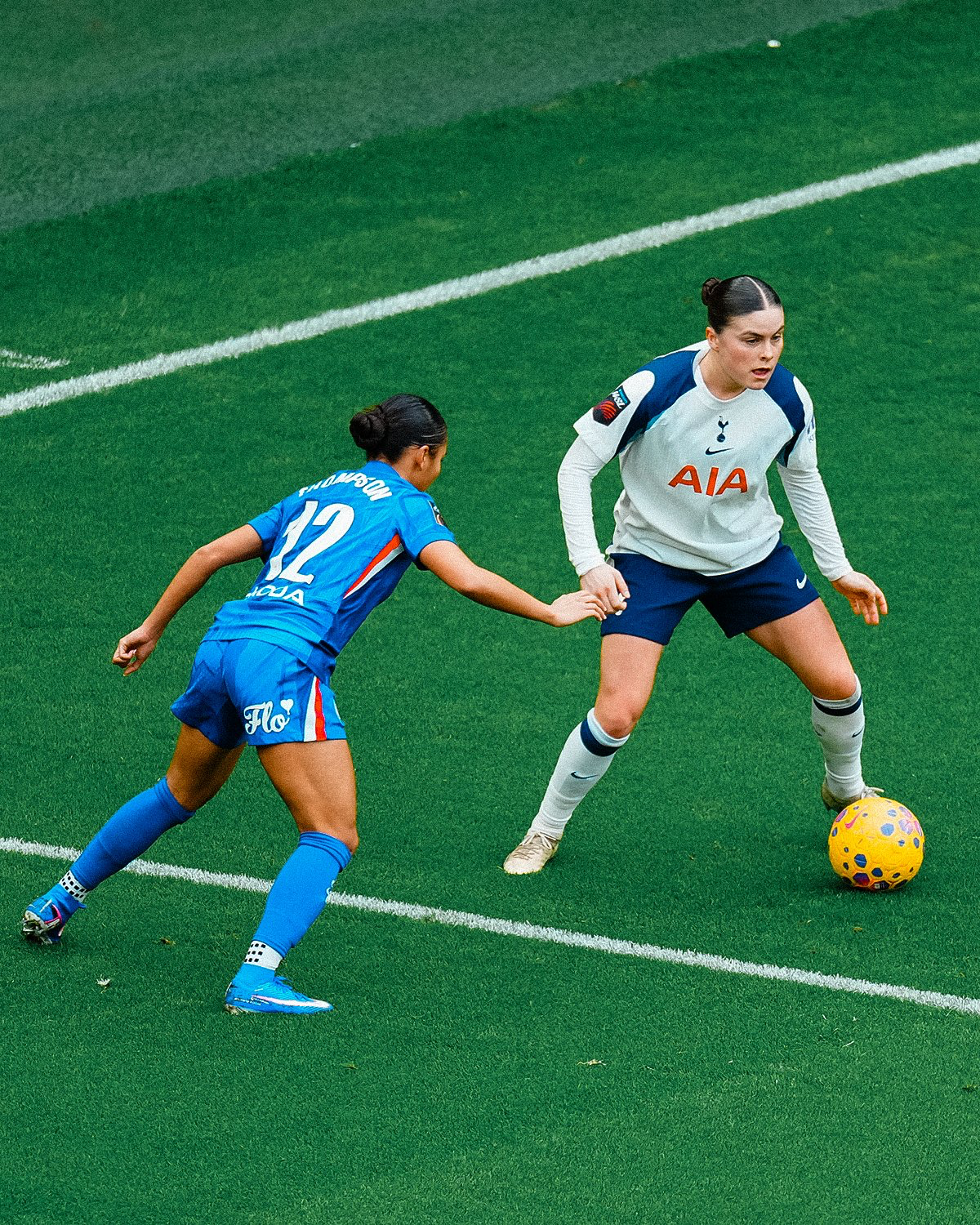 Hanna Wijk prepares to kick the ball past Alyssa Thompson.
