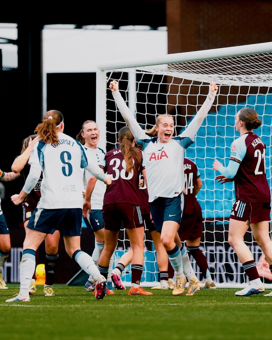 Julie Blakstad raises her arms to celebrate her first goal. 