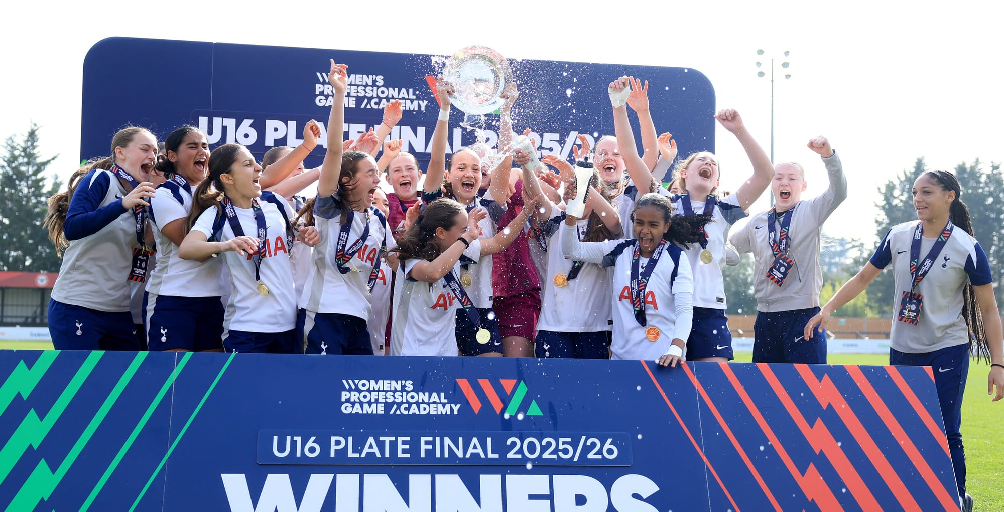 Women's Academy U16s lifting the PGA Plate trophy.