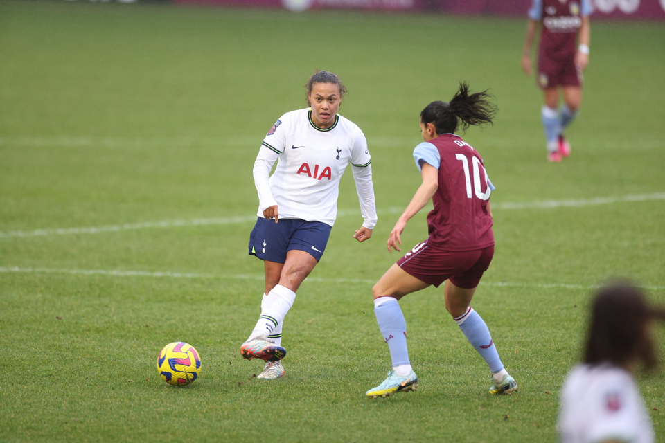 Drew Spence passes the ball past Aston Villa's Kenza Dali