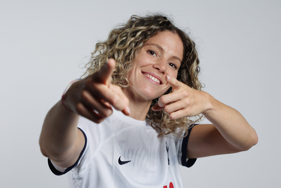 New Spurs Women signing Luana Bühler points to the camera with both hands.