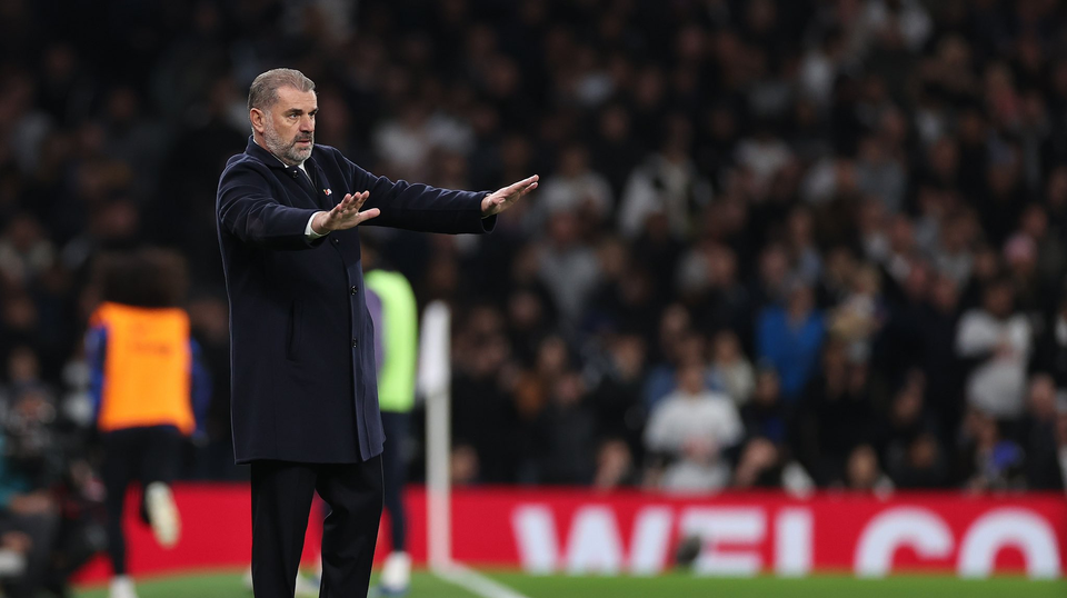 Ange Postecoglou gestures to his team to remain calm from the touchline. 