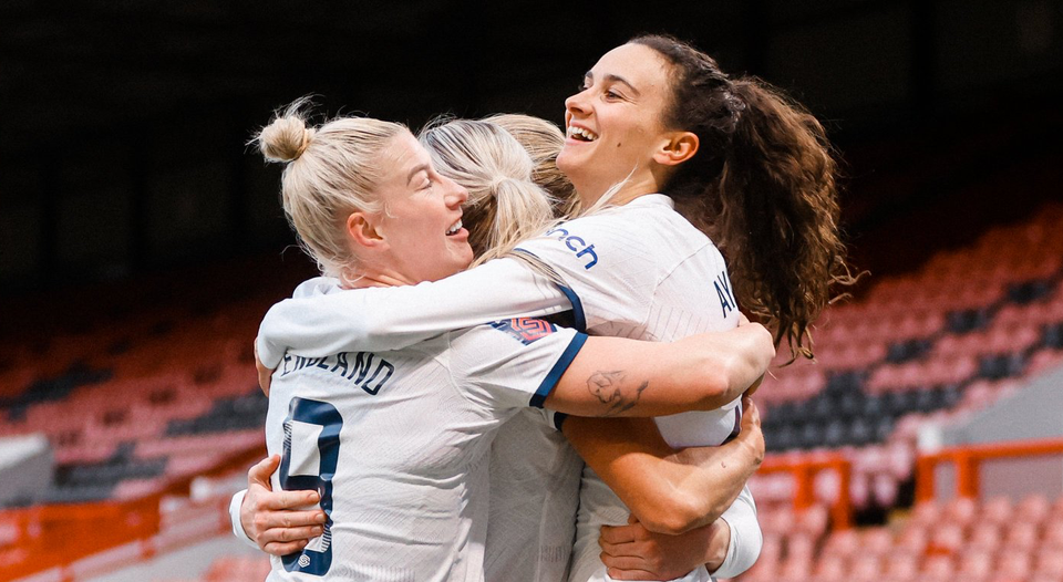 Beth England and Rosella Ayane hug to celebrate a last-minute winner.