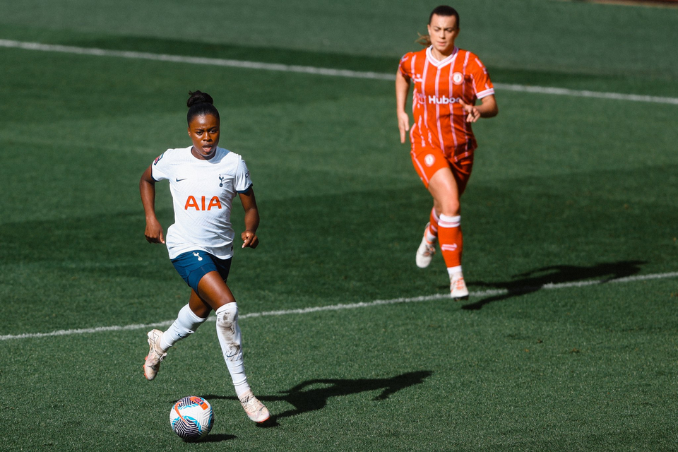 Jess Naz dribbles across the halfway line.