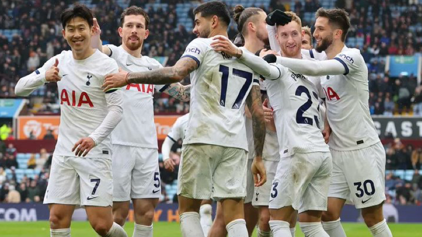 Son Heung-min gives a thumbs up as he celebrates a win with the team.