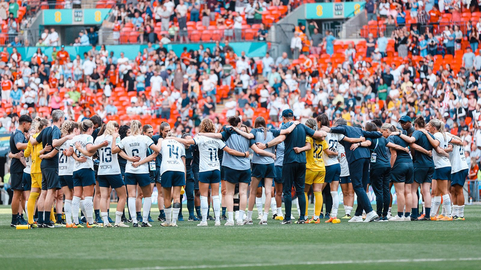 The Tottenham Hotspur Women squad huddles after defeat at Wembley in the FA Cup final.