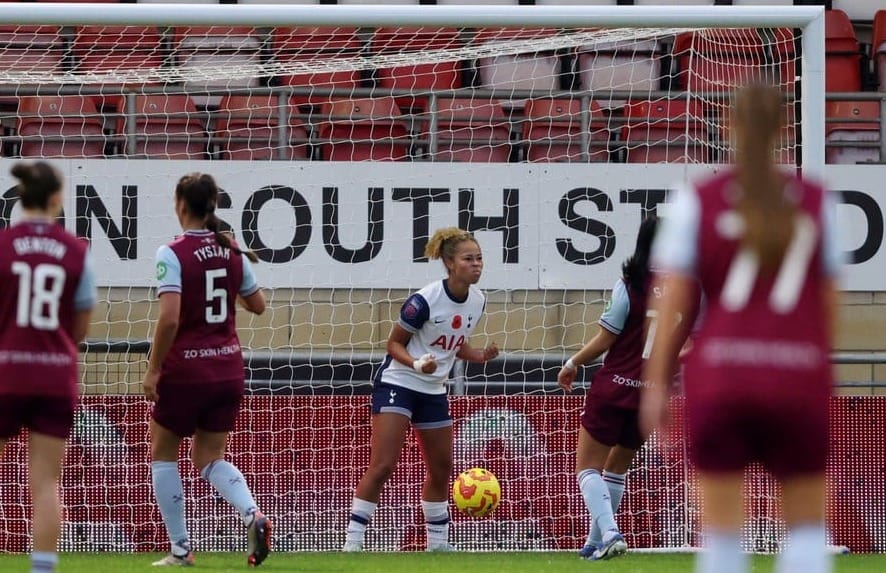 Lenna Gunning-Williams pumps her fists after forcing an own goal from West Ham.