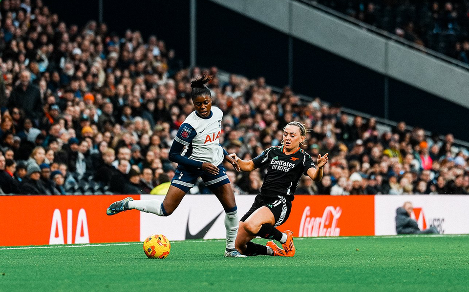 Jess Naz challenges Katie McCabe for the ball.