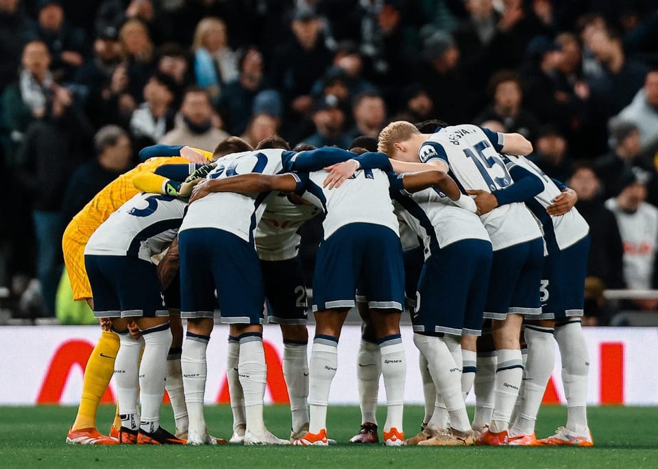 The players gather in the pre-match huddle. 